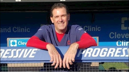 Dr. James Anderson smiles from a dugout at Progressive Field where he does a lot of outreach work.  